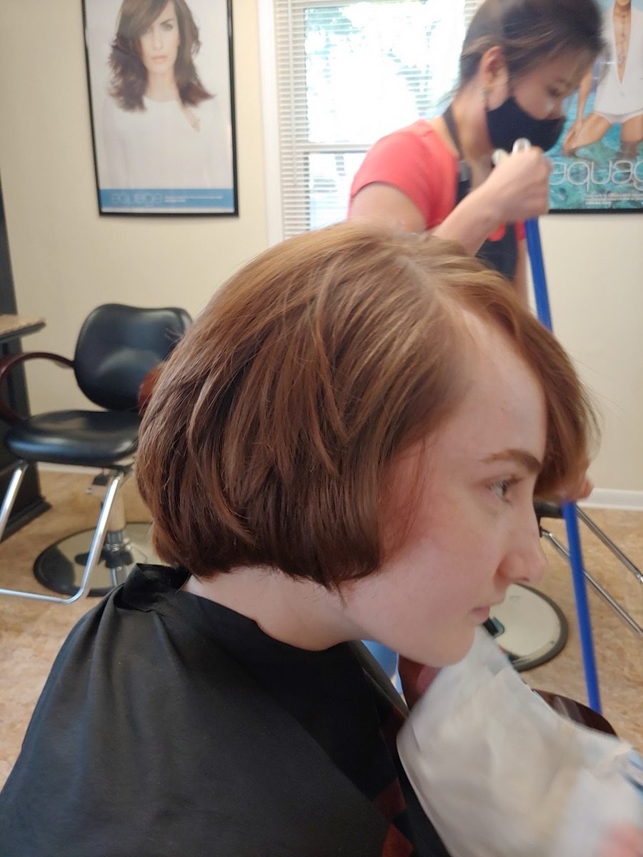 Soft, layered auburn bob cut and styled at Holly Salon