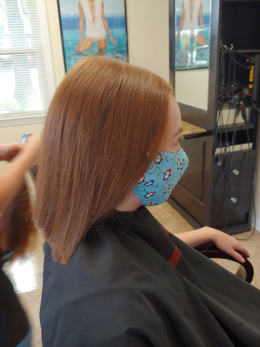 Glossy, freshly cut and styled auburn hair at Holly Salon in Stockbridge, GA
